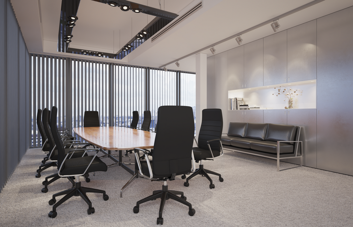 LeisureMod Hilton Modern High-Back Leather Office Chair Black at Table.