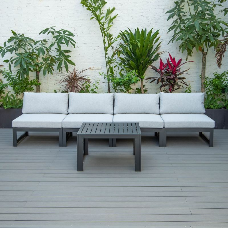 LeisureMod Chelsea 5-Piece Middle Patio Chairs and Coffee Table Set Black Aluminum with Cushions Light Grey on Deck.