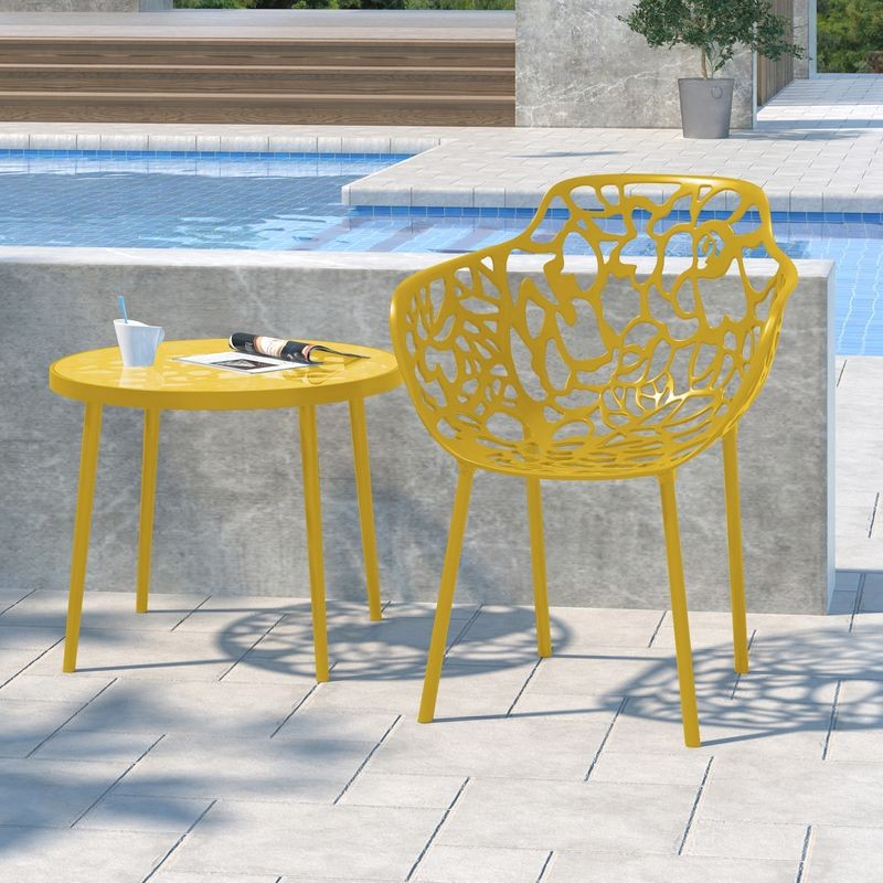 LeisureMod Modern Devon Aluminum Armchair Yellow at Table.
