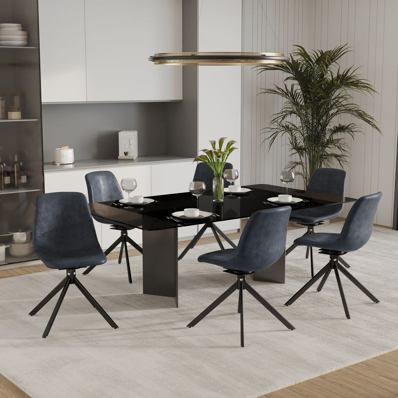 LeisureMod Markley Modern Leather Swivel Dining Chair With Metal Legs in Black at Table.