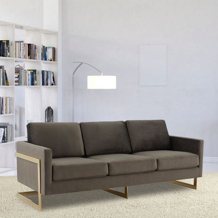 LeisureMod Lincoln Modern Mid-Century Upholstered Velvet Sofa with Gold Frame Dark Grey with Background.