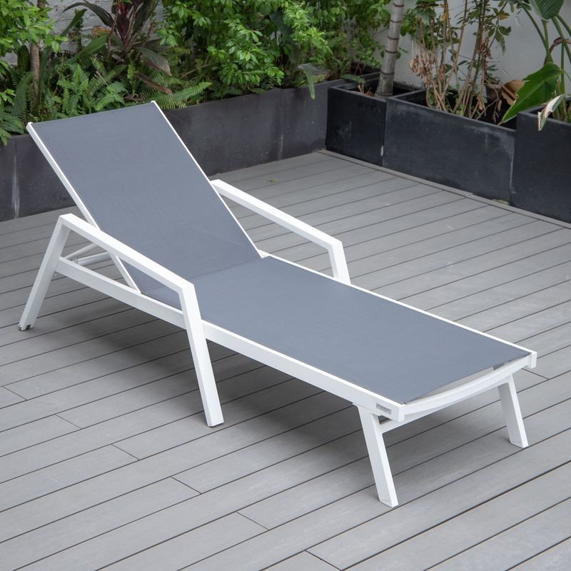 LeisureMod Marlin Patio Chaise Lounge Chair with Armrests in White Aluminum Frame Dark Grey Photo.