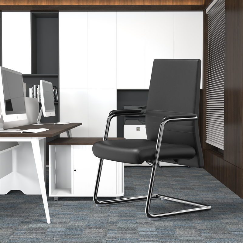LeisureMod Aleen Series Guest Office Chair in Black Leather at Desk.