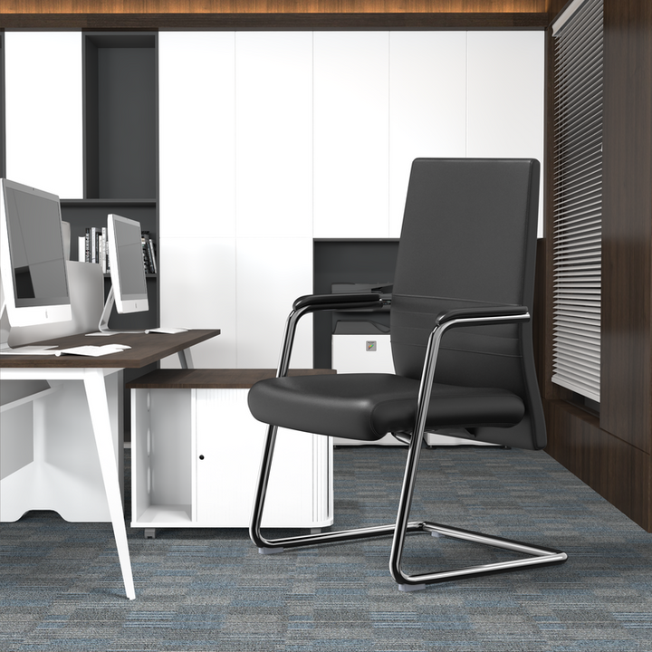 LeisureMod Aleen Series Guest Office Chair in Black Leather at Desk.