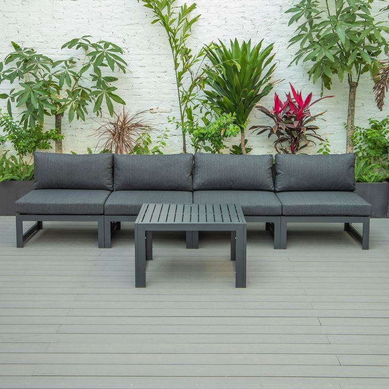 LeisureMod Chelsea 5-Piece Middle Patio Chairs and Coffee Table Set Black Aluminum with Cushions Black on Deck.