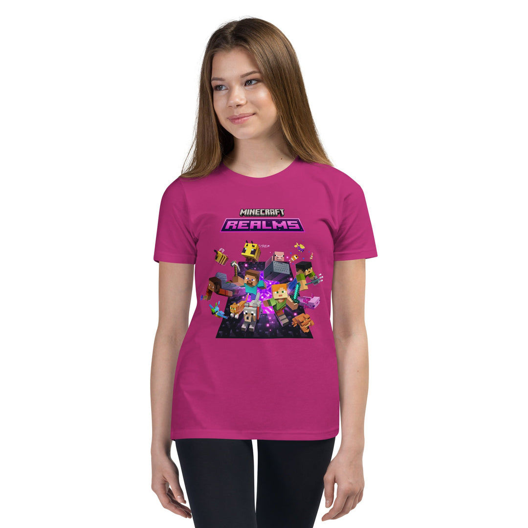 Person wearing a pink t-shirt with Minecraft Realms graphics on a white background.