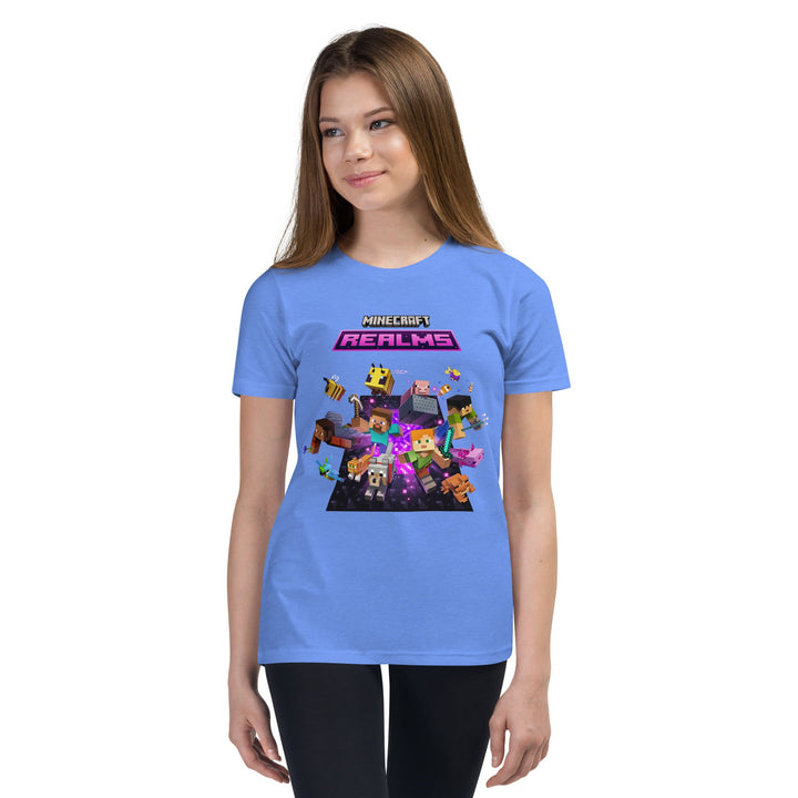 Person wearing a blue t-shirt with Minecraft Realms graphics on a white background.