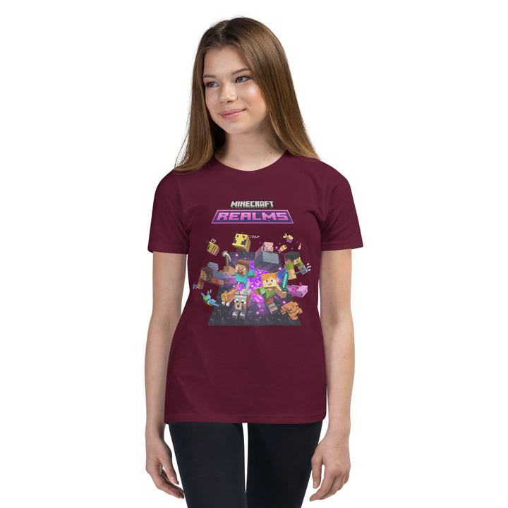 Girl wearing a maroon t-shirt with Minecraft Realms graphic on a white background.