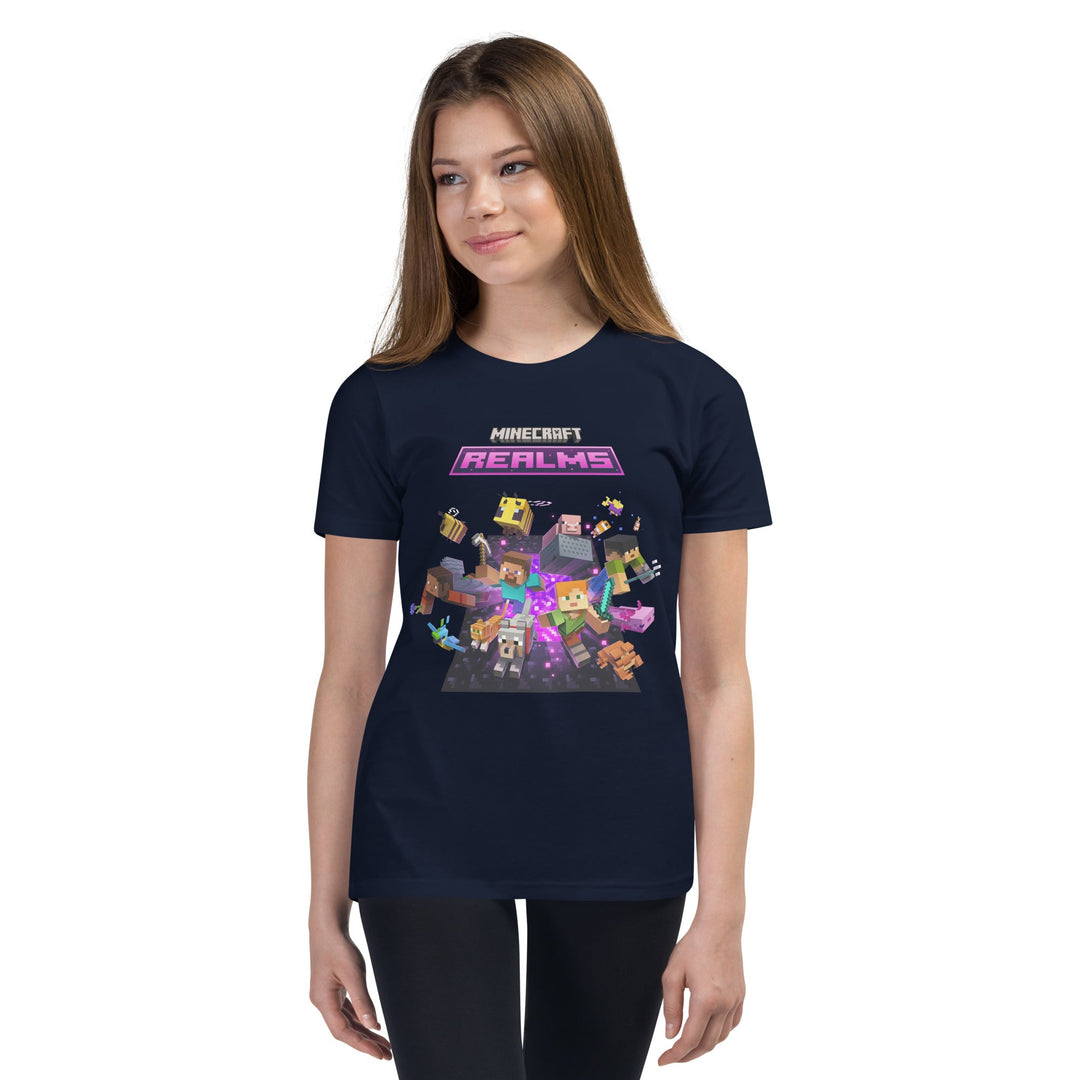 Person wearing a dark blue t-shirt with Minecraft Realms graphics on a white background.