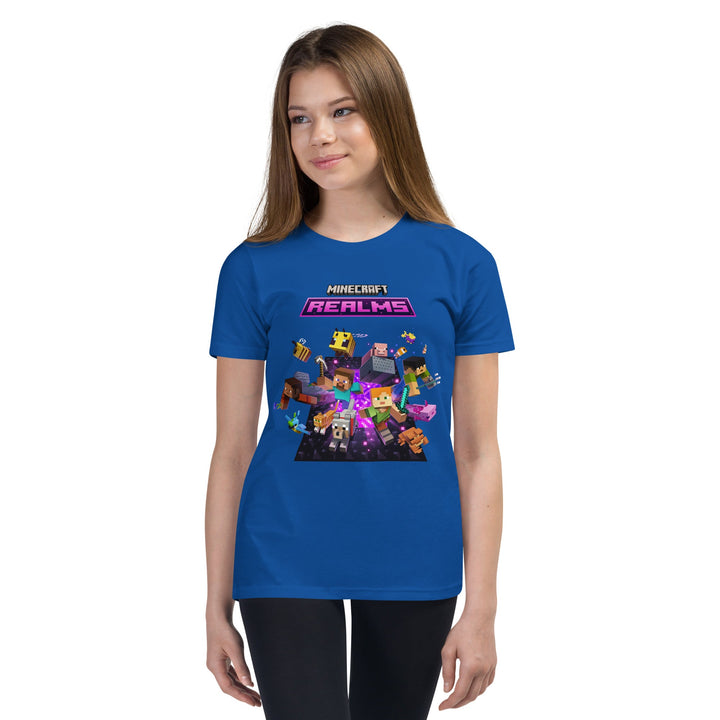 Person wearing a blue t-shirt with Minecraft Realms graphics on a white background.