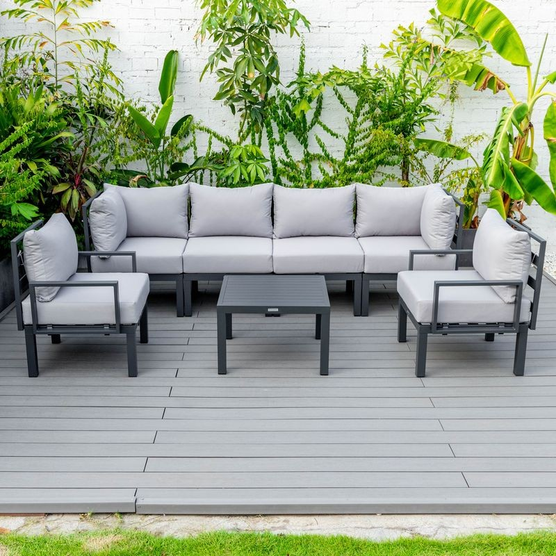 LeisureMod Chelsea 7-Piece Patio Sectional and Coffee Table Set Black Aluminum with Cushions Light Grey Photo.