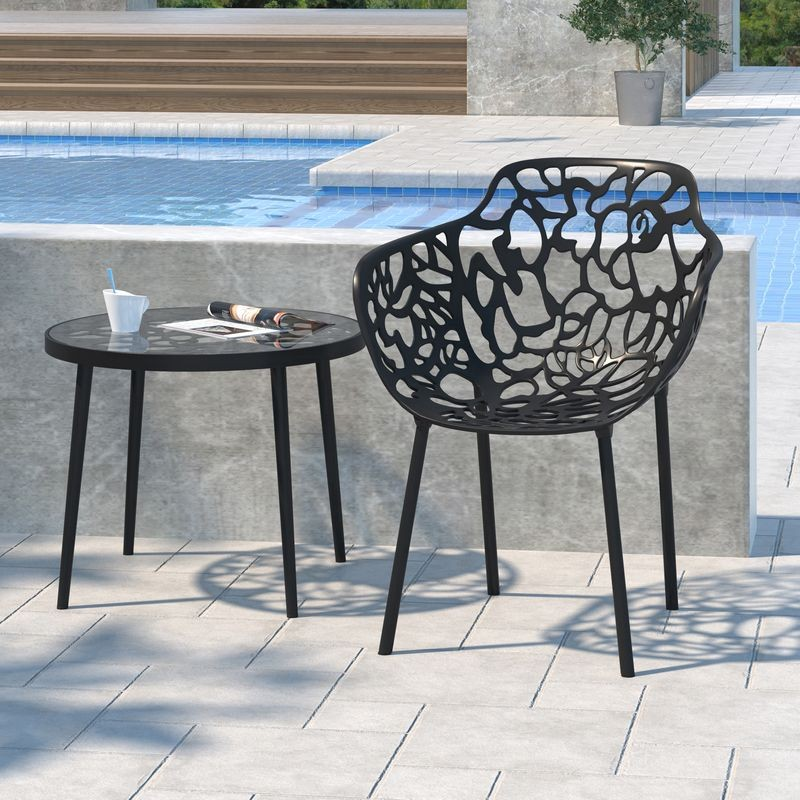 LeisureMod Modern Devon Aluminum Armchair Black at Table.