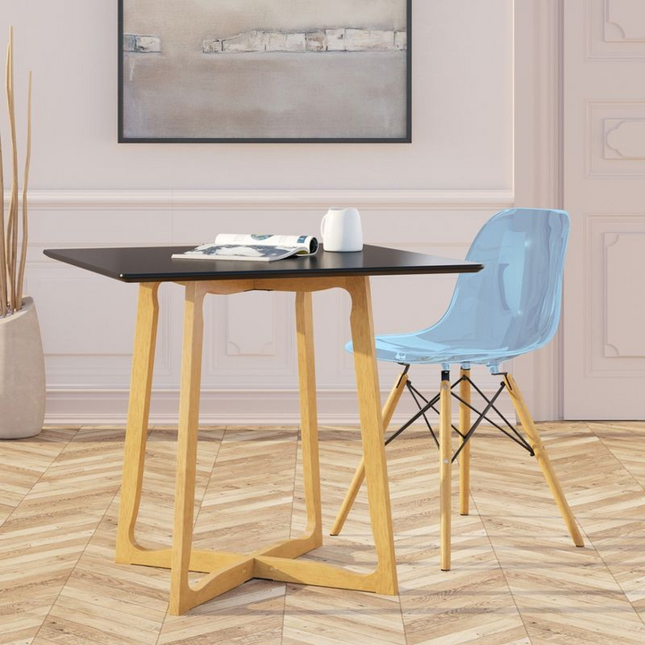 LeisureMod Dover Plastic Molded Dining Side Chair Transparent Blue at Table.